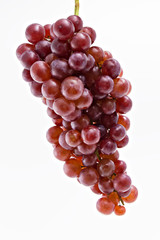 Fresh red grapes isolated on white background.