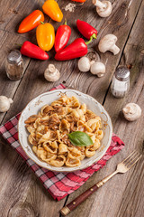Pork stew with mushrooms, basil and red pepper.