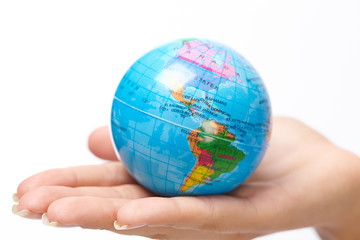 woman's hand with globe