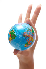 woman's hand with globe