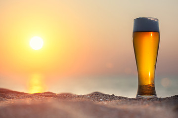 Glass of beer on a sunset