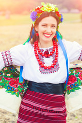 beautiful young woman wearing national ukrainian clothes posing