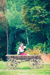 beautiful young woman wearing national ukrainian clothes sitting