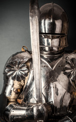 knight wearing armor and holding two-handed sword