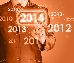 Businessman touching new year 2014