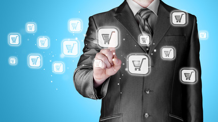 Businessman pushing shopping cart