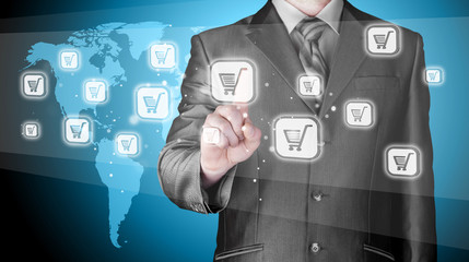 Businessman pushing shopping cart