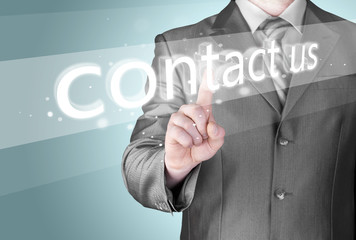 Businessman pushing CONTACT US sign