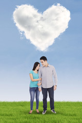 Asian couple and heart symbol