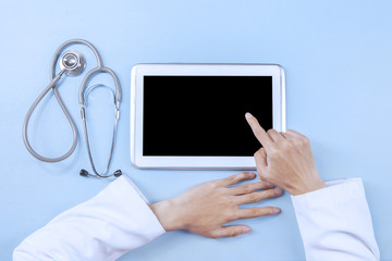 Doctor working on a digital tablet