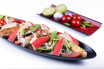 Thai spicy seafood salad on the plate