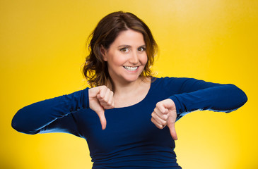 Woman showing thumbs down gesture happy someone made mistake