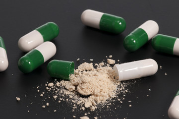 Opened Capsule on Black Background