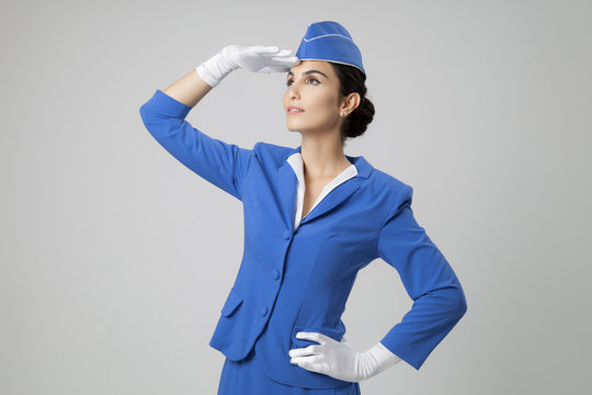 Charming Stewardess Dressed In Blue Uniform
