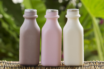 Strawberry, chocolate and fresh milk bottles