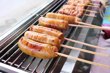 grilled sausage on a barbecue grill