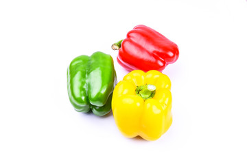 red, green and yellow paprika on a white screen