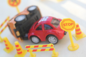 car Accident zone cordoned off with a yellow stop sign post