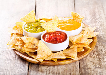 nachos with various sauces