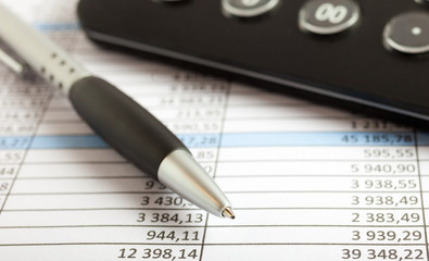 Pen over a business document