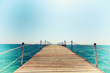 Obraz premium Pier in blue sea vintage toning