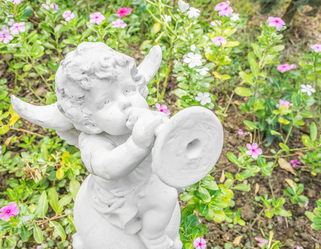 Fairy Statue in the garden with flower