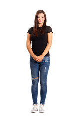 Young brunette in modern casual clothes holding her hands