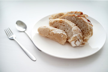 Bread served on white table