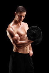 Fototapeta na wymiar Handsome bodybuilder exercising with a barbell