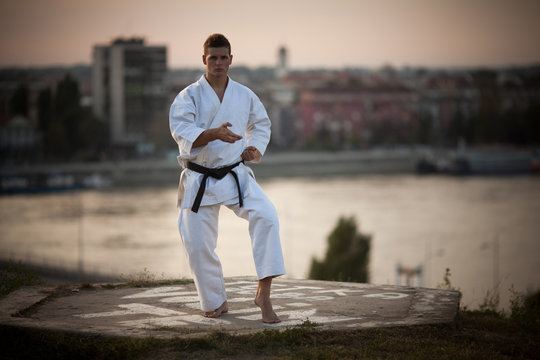 Man practicing martial arts outdoors