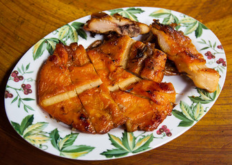 Grilled chicken on the plate ready to eat.