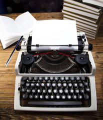 Retro typewriter with white paper 