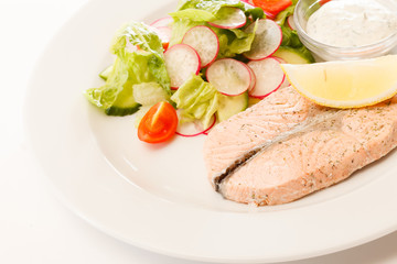 salmon steak with salad