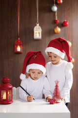 Two adorable boys, writing letter to Santa