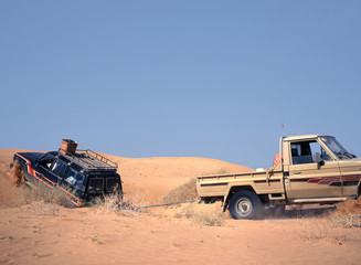 Broken down vehicle in the sand of the desert © robepco