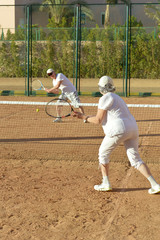 Obraz premium Senior couple playing tennis