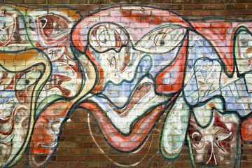 Obraz na płótnie Canvas Graffiti auf einer Ziegelwand - Hintergrund