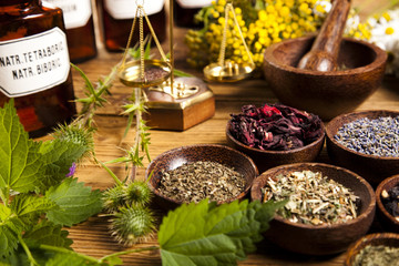  Fresh medicinal herbs on wooden 