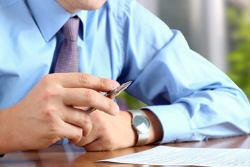 businessman  doing business, sitting at his desk in the office,