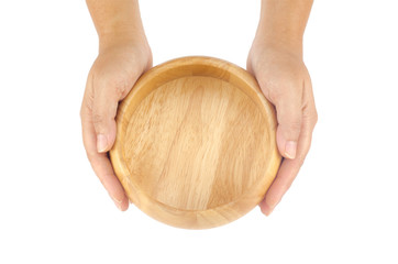 Woman's hands holding wooden bowl