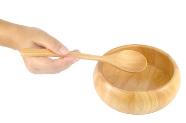Woman's hand holding wooden spoon