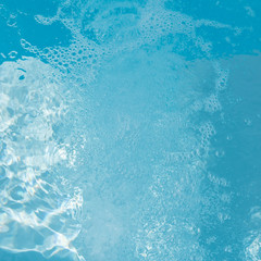 Background of rippled pattern of clean water in a blue