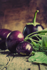 Eggplants on the wooden background