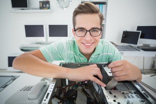 Technician working on broken computer