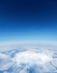Fototapeta na wymiar Digitally generated graphic Blue sky over white clouds
