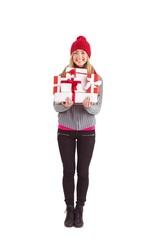 Festive blonde holding pile of gifts