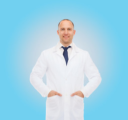 smiling male doctor in white coat