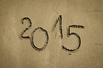 number 2015 written into sand