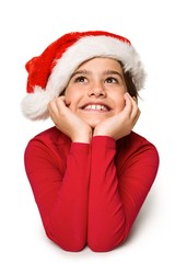 Festive little girl smiling and looking up