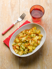 potatoes salad with tomatoes and parsley